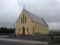 a church, notice the celtic cross on the roof, prime example of simbology communion of christianity and local heritage: the irish embraced cristianity but did not relegate their own origins