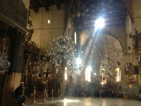 While the crowd queue to enter the grotto where Jesus was said to be born, a sun ray peacefully illuminates the desired spot