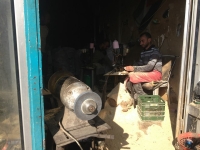 In Bethlehem, Palestinians at work, under a mountain of sawdust