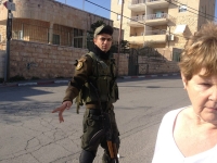 A Palestinian soldier asking us to move away from the road, look at his AK-47 rifle, Russian made, very reliable but ancient compared with the Israeli guns