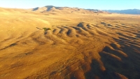 Terrain ondulations like that in Camas Prairie (Montana) were formed by the rush of water