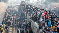 Overpopulation is an issue. People in a train in Bangladesh going to work. They all need calories, water and resources to survive everyday 