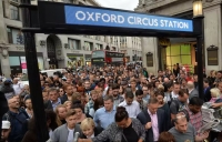 Overpopulation is an issue. People entering a train station in London going to work. They are willing to let somebody else to exploit the resources of other countries for a better quality of living in their own areas